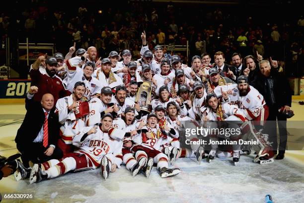 The Denver Pioneers celebrate after beating the Minnesota-Duluth Bulldogs during the 2017 NCAA Division I Men's Ice Hockey Championship game at the...