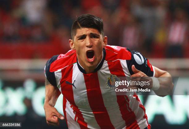 Alan Pulido of Chivas celebrates after scoring his team's first goal during the 13th round match between Chivas and Puebla as part of the Torneo...