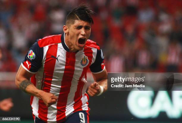 Alan Pulido of Chivas celebrates after scoring his team's first goal during the 13th round match between Chivas and Puebla as part of the Torneo...