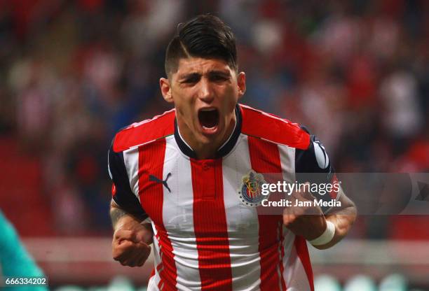 Alan Pulido of Chivas celebrates after scoring his team's first goal during the 13th round match between Chivas and Puebla as part of the Torneo...