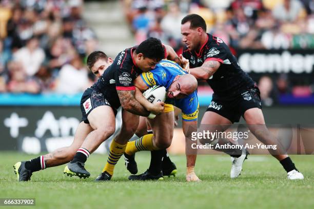 Jacob Lillyman of the Warriors is tackled by Issac Luke of the Warriors during the round six NRL match between the New Zealand Warriors and the...