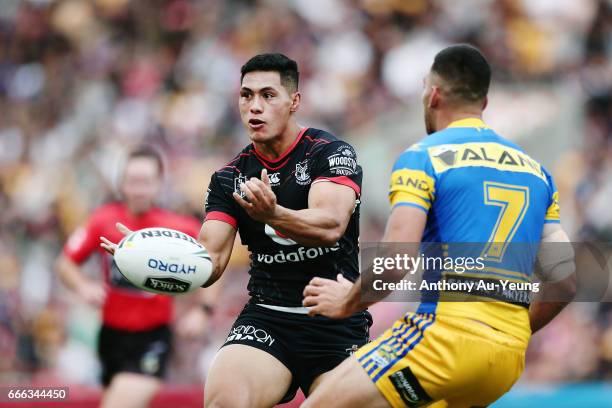 Roger Tuivasa-Sheck of the Warriors with a pass against Corey Norman of the Eels during the round six NRL match between the New Zealand Warriors and...