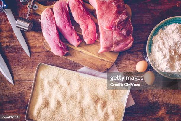 preparing wiener schnitzel - wiener schnitzel stock pictures, royalty-free photos & images