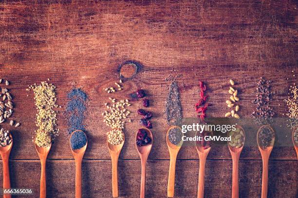 variation of superfood chia, quinoa, poppy seed and nuts - poppy seed stock pictures, royalty-free photos & images