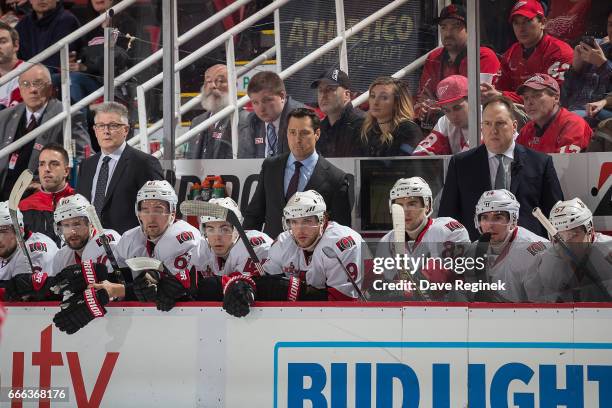 Associate coach Marc Crawford and head coach Guy Boucher and assistant coach Martin Raymond of the Ottawa Senators watches the action from the bench...