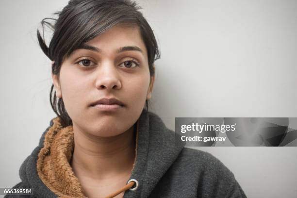 close-up of serene asian girl thinking. - serious child stock pictures, royalty-free photos & images