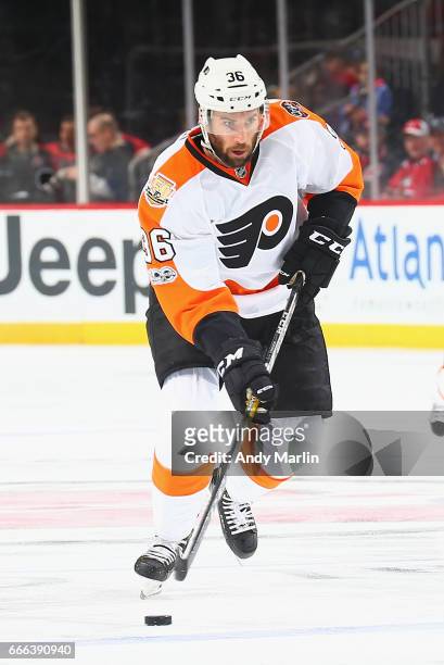 Colin McDonald of the Philadelphia Flyers plays the puck against the New Jersey Devils during the game at Prudential Center on April 4, 2017 in...
