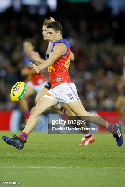 Jake Barrett of the Lions kicks the ball during the round three AFL match between the St Kilda Saints and the Brisbane Lions at Etihad Stadium on...