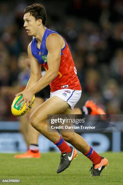 Hugh McCluggage of the Lions runs with the ball during the round three AFL match between the St Kilda Saints and the Brisbane Lions at Etihad Stadium...