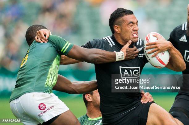 Sione Molia of New Zealand is tackled during the 2017 Hong Kong Sevens match between South Africa and New Zealand at Hong Kong Stadium on April 9,...