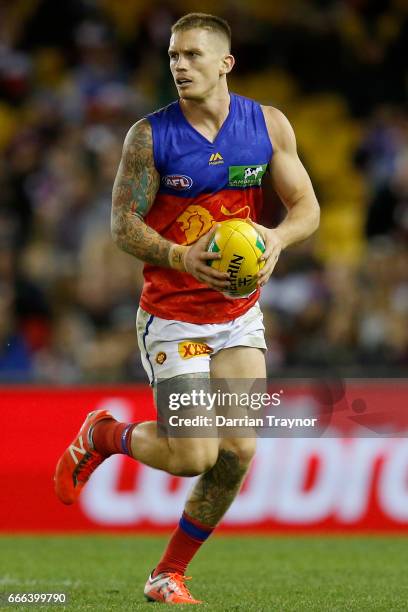 Dayne Beams of the Lions runs with the ball during the round three AFL match between the St Kilda Saints and the Brisbane Lions at Etihad Stadium on...