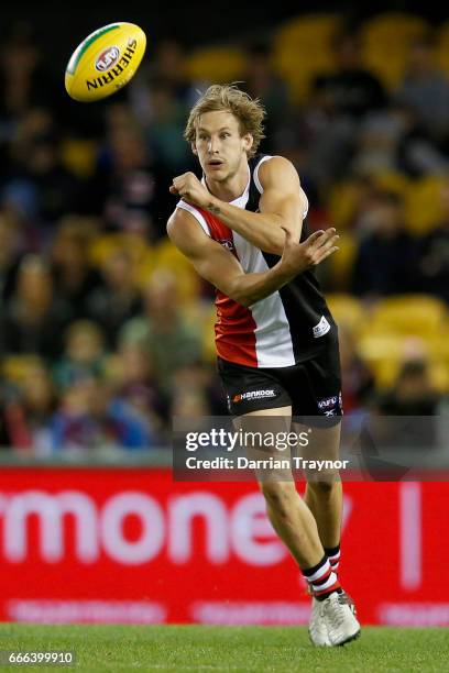 Jimmy Webster of the Saints handballs during the round three AFL match between the St Kilda Saints and the Brisbane Lions at Etihad Stadium on April...