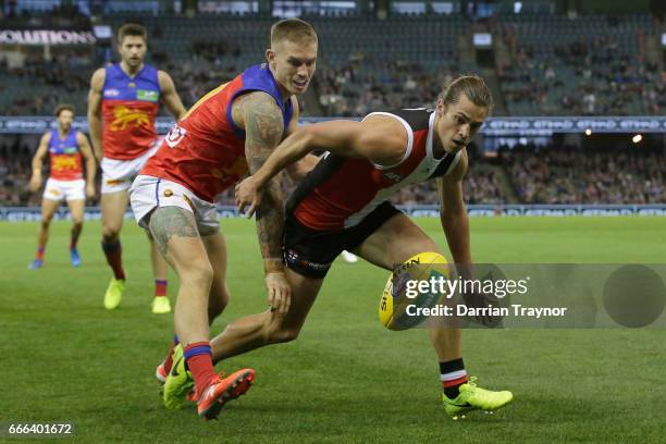 Dayne Beams of the Lions chases Jack Steele of the Saints during the round three AFL match between the St Kilda Saints and the Brisbane Lions at...