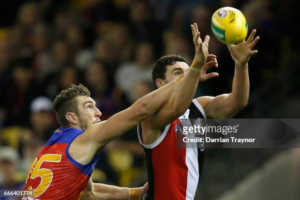 Daniel McStay of the Lions spoils Paddy McCartin of the Saints during the round three AFL match between the St Kilda Saints and the Brisbane Lions at...
