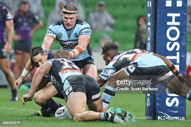 Paul Gallen of the Sharks and Matt Prior of the Sharks look on as James Segeyaro of the Sharks scores the match-winning try as Billy Slater of the...