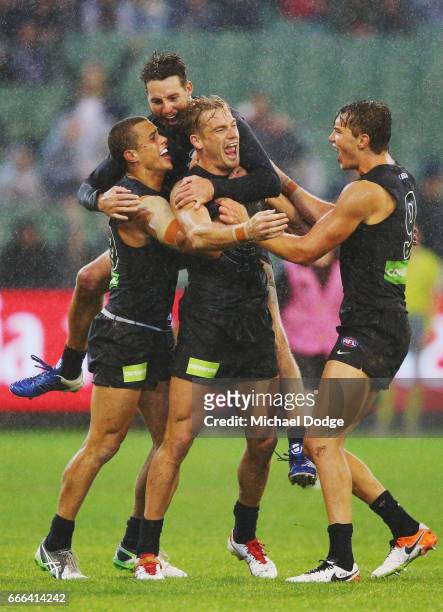 Sam Kerridge of the Blues celebrates the match sealing goal with Ed Curnow and Dale Thomas and Patrick Cripps of the Blues during the round three AFL...
