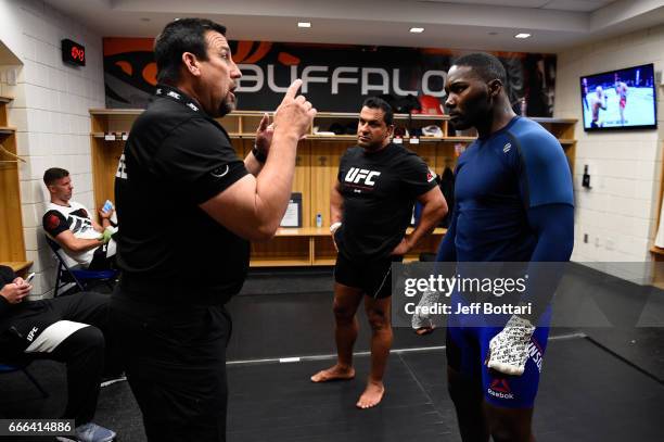 Anthony Johnson receives instructions from John McCarthy backstage during the UFC 210 event at the KeyBank Center on April 8, 2017 in Buffalo, New...