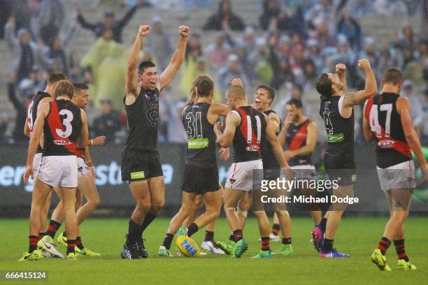 Matthew Kreuzer of the Blues celebrates winning on the final siren with Marc Murphy and Bryce Gibbs during the round three AFL match between the...
