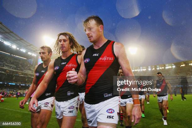 Jobe Watson Dyson Heppell and Brendon Goddard of the Bombers looks dejected after defeat during the round three AFL match between the Carlton Blues...