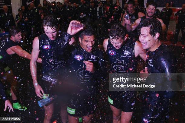 Sam Petrevski-Seton, Tom Williamson and Jack Silvagni of the Blues of the Blues celebrate the win with teammates during the round three AFL match...