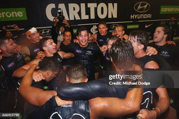 Jack Silvagni of the Blues celebrates the win with teammates during the round three AFL match between the Carlton Blues and the Essendon Bombers at...