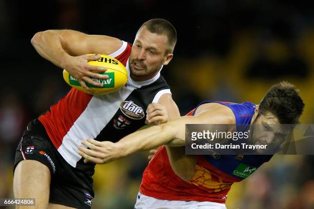 Jarryn Geary of the Saints gathers the ball during the round three AFL match between the St Kilda Saints and the Brisbane Lions at Etihad Stadium on...
