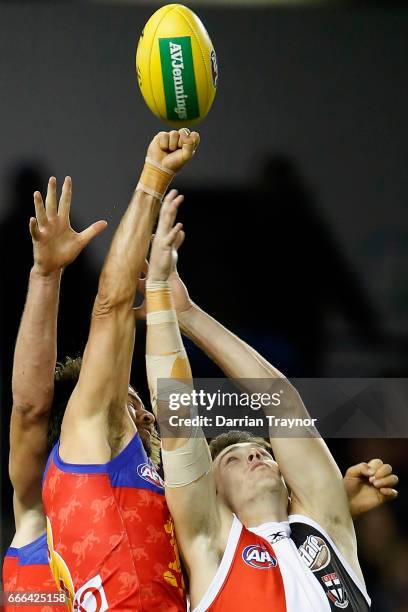 Rohan Bewick of the Lions spoils Blake Acres of the Saints during the round three AFL match between the St Kilda Saints and the Brisbane Lions at...