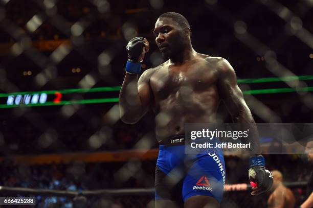 Anthony Johnson walks back to his corner after the first round against Daniel Cormier in their UFC light heavyweight championship bout during the UFC...