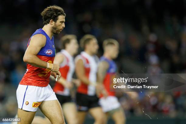 Rohan Bewick of the Lions spits during the round three AFL match between the St Kilda Saints and the Brisbane Lions at Etihad Stadium on April 9,...