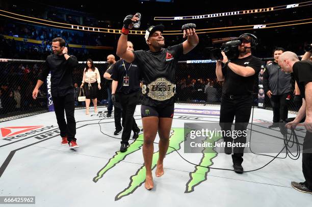 Daniel Cormier celebrates after defeating Anthony Johnson in their UFC light heavyweight championship bout during the UFC 210 event at the KeyBank...