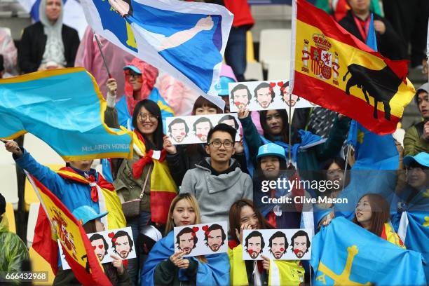 Fernando Alonso of Spain and McLaren Honda fans in the grandstand during the Formula One Grand Prix of China at Shanghai International Circuit on...