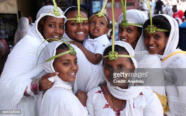 Ethiopians are seen with their leaf crowns for the Hosanna Day celebrations ahead of the Easter, near the St. Urael Orthodox Church in Addis Ababa,...