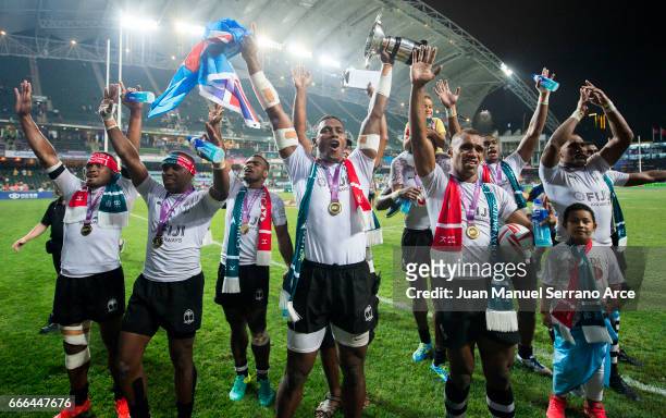 Fiji players celebrate with the trophy after winning the 2017 Hong Kong Sevens final against South Africa at Hong Kong Stadium on April 9, 2017 in...