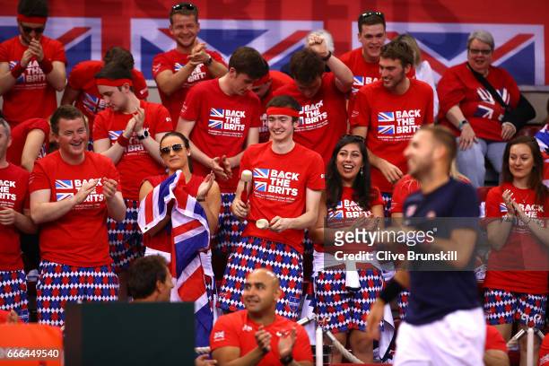 Great Britain fans enjoy the atmosphere in the singles match between Daniel Evans of Great Britain and Julien Benneteau of France during day 3 of the...