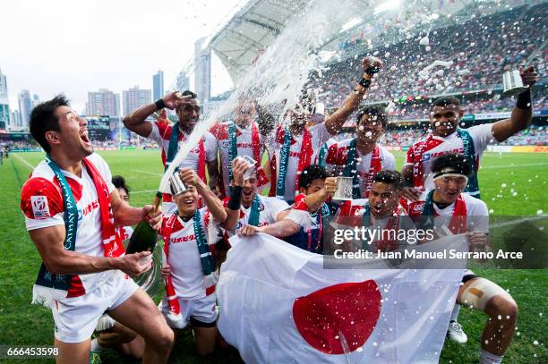 Japan players celebrate with the trophy after winning the Shield final match against Wales during the 2017 Hong Kong Sevens at Hong Kong Stadium on...