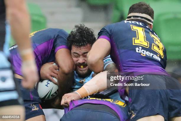 Andrew Fifita of the Sharks is tackled during the round six NRL match between the Melbourne Storm and the Cronulla Sharks at AAMI Park on April 9,...