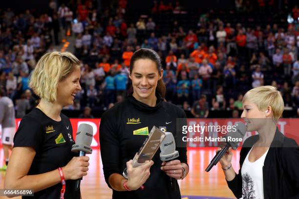 Beachvolley ball gold medalist of Rio 2016 Laura Ludwig and Kira Walkenhorst pose with the sport1 trophy during the Rewe Final Four final match...