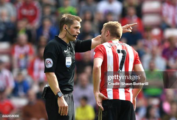 Sebastian Larsson of Sunderland is sent off by referee Craig Pawson for a challenge on Ander Herrera of Manchester United during the Premier League...