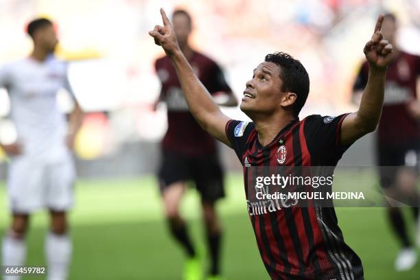 Milan's forward from Colombia Carlos Bacca celebrates after scoring during the Italian Serie A football match AC Milan vs Palermo on April 9, 2017 at...