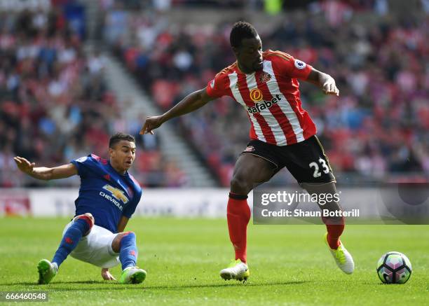 Lamine Kone of Sunderland is challenged by Jesse Lingard of Manchester United during the Premier League match between Sunderland and Manchester...