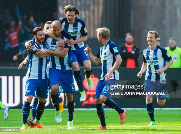 Berlin players celebrate after Berlin's US defender John Anthony Brooks scored the opening goal during the German first division Bundesliga football...