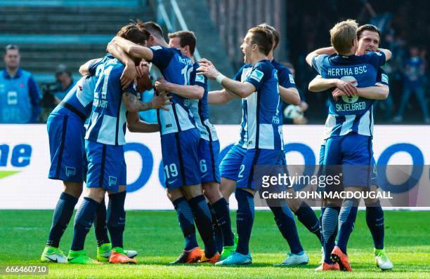 Berlin players celebrate after Berlin's US defender John Anthony Brooks scored the opening goal during the German first division Bundesliga football...