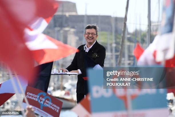 French presidential election candidate for the far-left coalition La France insoumise Jean-Luc Melenchon smiles during a public meeting at the Old...