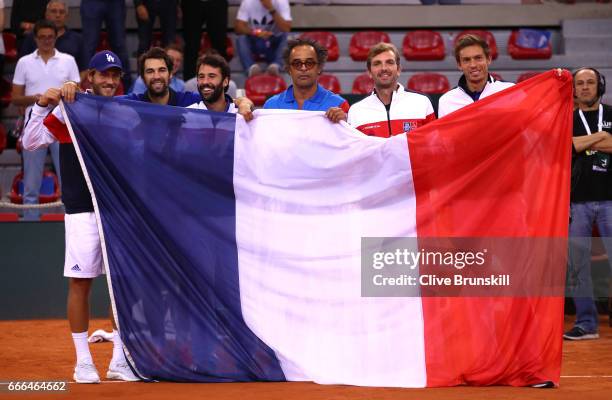 Lucas Pouille, Jeremy Chardy, Jonathan Eysseric, captain Yannick Noah, Julien Benneteau and Nicolas Mahut of France celebrate their victory against...