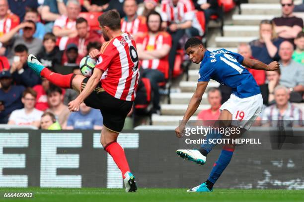 Sunderland's Italian striker Fabio Borini blocks the ball from Manchester United's English striker Marcus Rashford during the English Premier League...