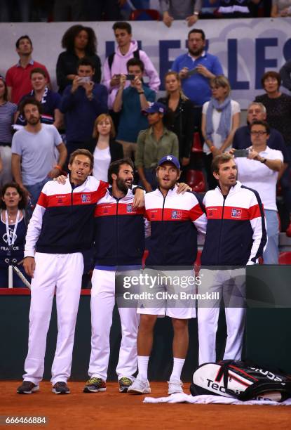 Nicolas Mahut, Jonathan Eysseric, Lucas Pouille and Julien Benneteau of France celebrate their victory against Great Britain on day 3 of the Davis...