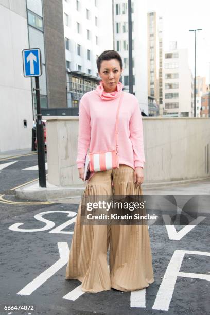 TFashion buyer Jeannie Lee wears a Balenciaga bag on day 4 of London Womens Fashion Week Autumn/Winter 2017, on February 20, 2017 in London, England.