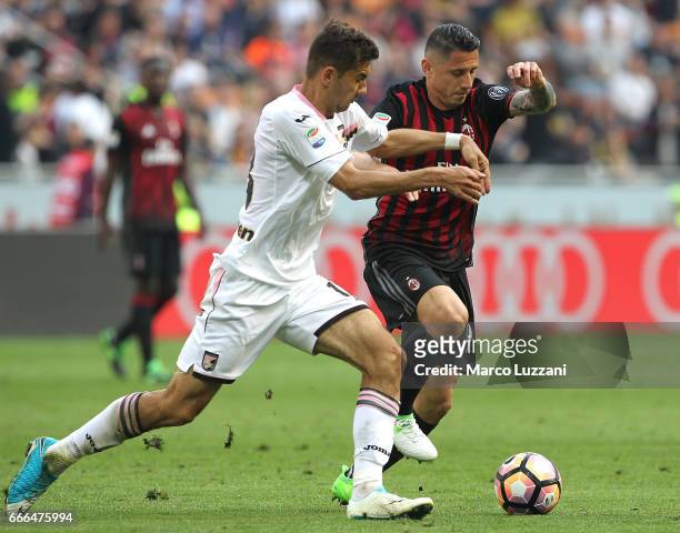 Gianluca Lapadula of AC Milan competes for the ball with Ivaylo Chochev of US Citta di Palermo during the Serie A match between AC Milan and US Citta...