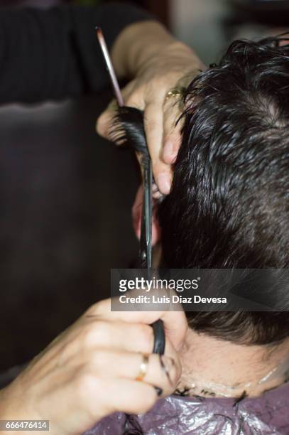 haircut at home with scissors - adulto maduro stock pictures, royalty-free photos & images