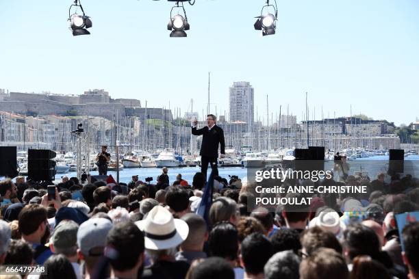 French presidential election candidate for the far-left coalition La France insoumise Jean-Luc Melenchon delivers a speech during a public meeting at...